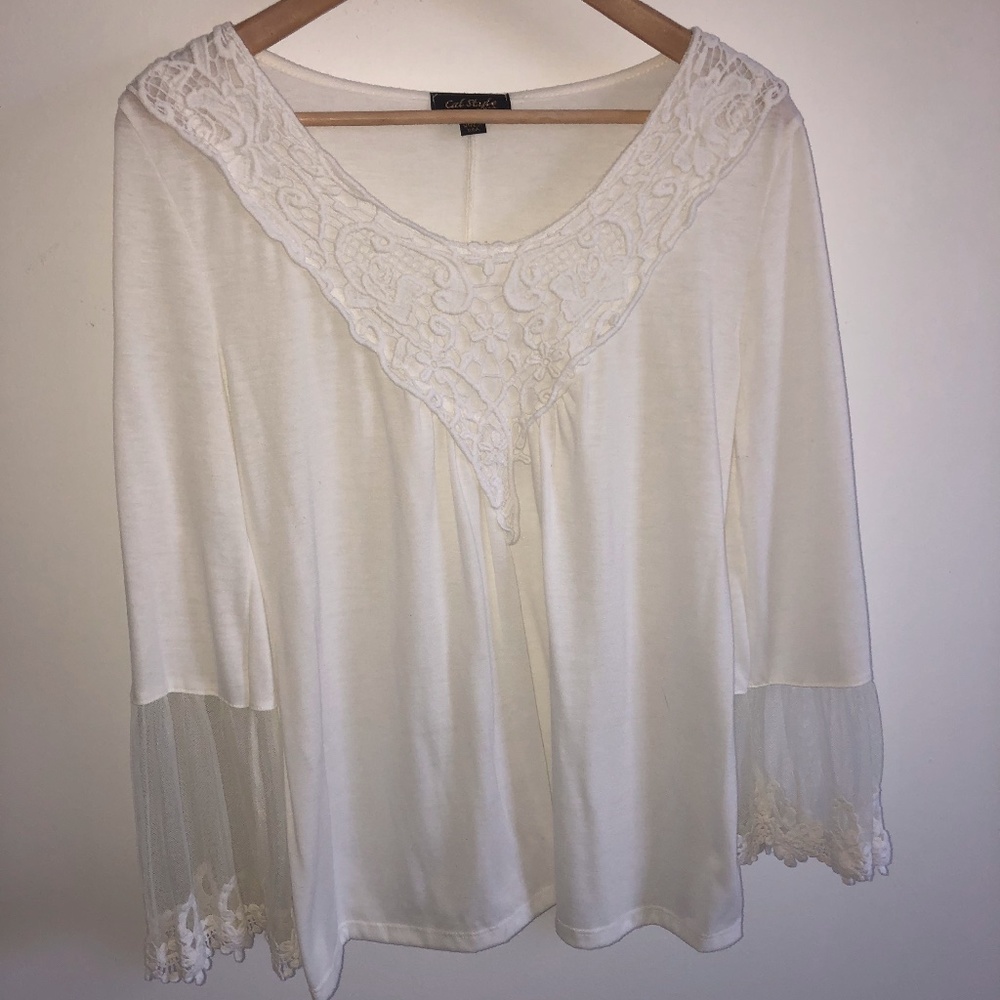 A crochet & lace knit top